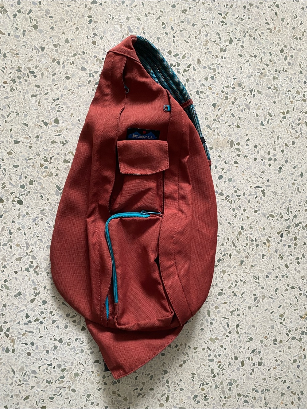 Kavu Rust Red Sling Bag with Teal Trim
